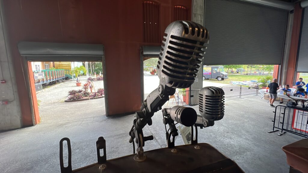 Standing at the microphone on the back of President Truman's Ferdinand Magellan Presidential Railcar, also known as U.S. Car No. 1 at the Gold Coast Railroad Museum 