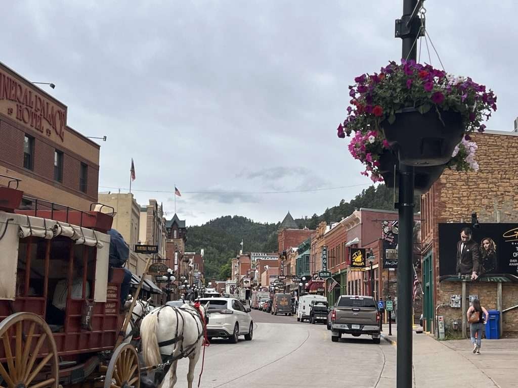Streets of Deadwood South Dakota with a horse drawn carriage 