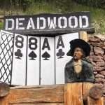 Dahl chainsaw carving in Deadwood South Dakota of Wild Bill and the deadman's hand