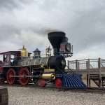 steam locomoties facing off at Promitory POint in Utah where the golden spike was laid connected America