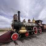 steam locomoties facing off at Promitory POint in Utah where the golden spike was laid connected America